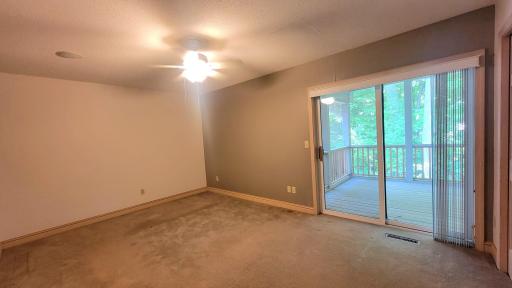 Bedroom with doors screened porch