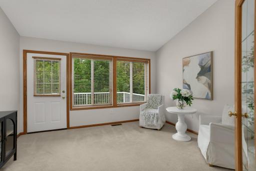 Light-filled sunroom overlooking the peaceful backyard