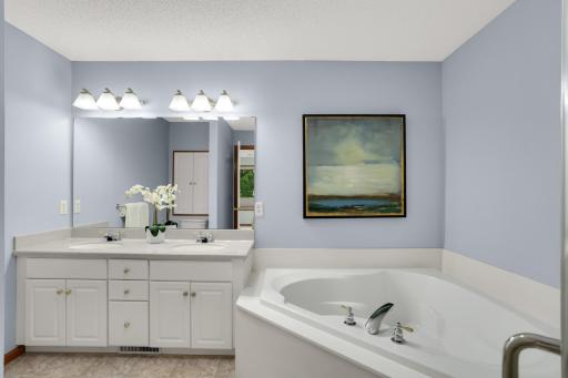 Relaxing primary suite offering a full, private spa bath
