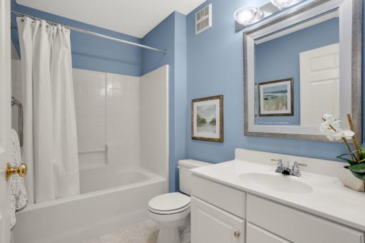 Bright main-floor full bath offering added convenience