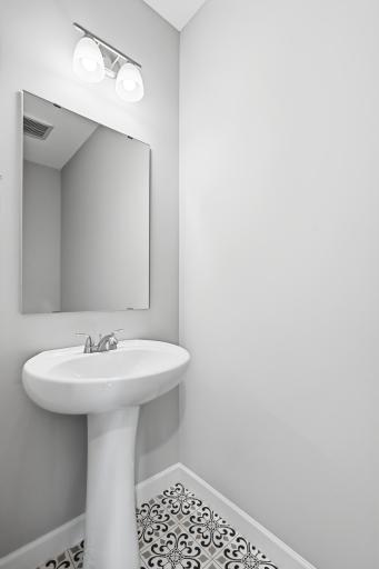 Power bath tucked away on main level for privacy and convince. *photos taken of previously completed home, not all finishes & options the same.*