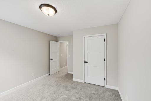 Fourth bedroom on upper level. *photos taken of previously completed home, not all finishes & options the same.*