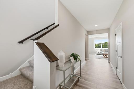 Wide Hallways and LVP through the main living and dining spaces! *photos taken of previously completed home, not all finishes & options the same.*