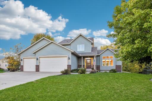 Photo for 17689 Fair Isle Path, Farmington, MN 55024 - listing #7146173 Great street appeal with brick & vinyl siding, curved sidewalk to covered front step, triple garage & concrete driveway.