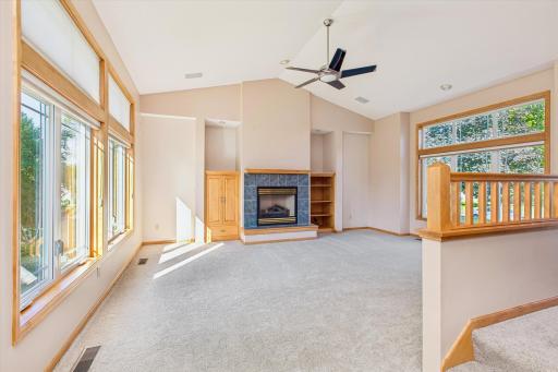 This great room has gas fireplace with hearth 8 & storage on both sides. Here is a great photo showing all the sunshine in this wonderful room.