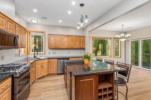 Gorgeous kitchen has loads of cabinets w/granite countertops, and large center island.