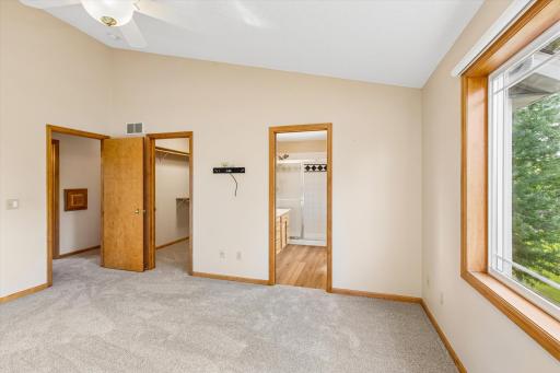 The primary bedroom has a very spacious walk-in closet, & notice the laundry chute right outside!