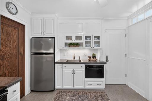 Kitchen off garage for easy grocery runs and garbage