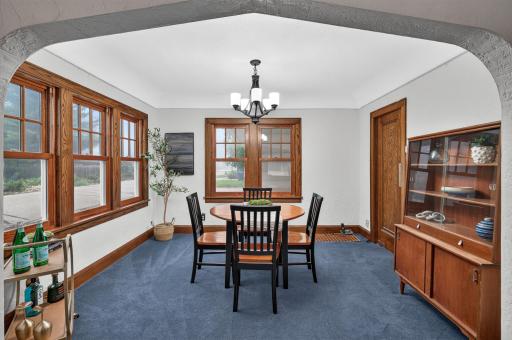 Dining room-updated windows, wood floors under carpet