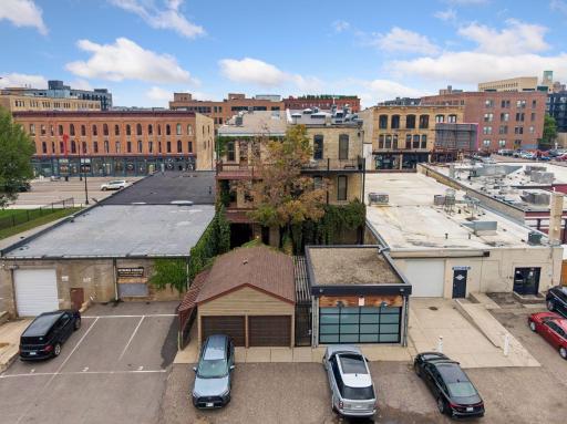 Rear of building showing garage and parking