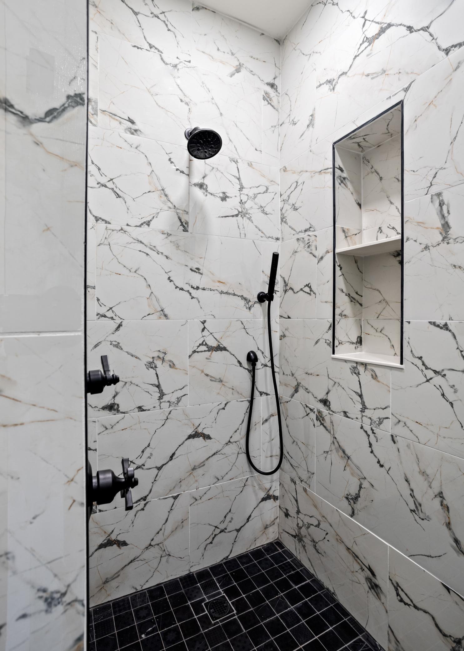 Walk in tiled shower primary bath