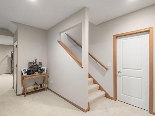 Lower Level Stairway â Finished lower level offers abundant additional living space and storage.