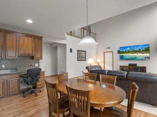 Informal Dining & Great Room â Open main-level design connects the kitchen, informal dining and two-story great room.