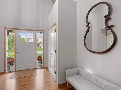 Foyer â Soaring entry welcomes you with hardwood floors and abundant natural light.