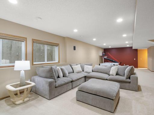 Lower-Level Family & Recreation Areas â Finished lower level provides multiple flexible living spaces with high ceilings and recessed lighting.