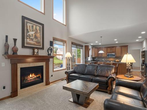 Great Room â Dramatic two-story great room with gas fireplace, tall windows and an open connection to the kitchen.