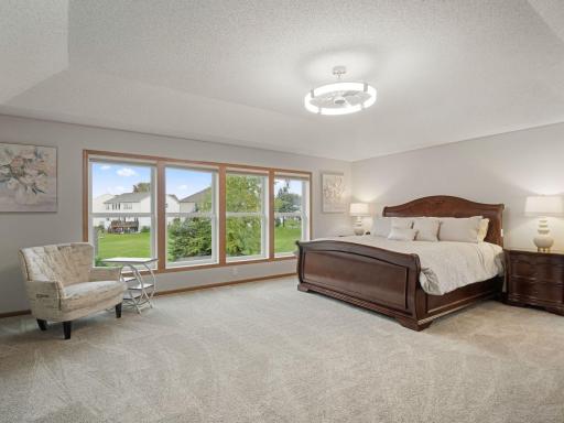 Expansive Primary Retreat with a Wall of Windows and Exceptional Natural Light