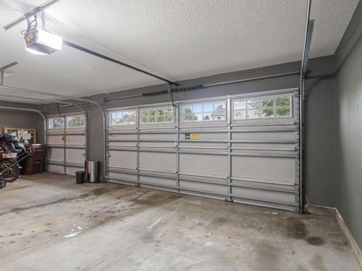 Spacious Three-Car Garage Offering Plenty of Room for Vehicles, Storage and More