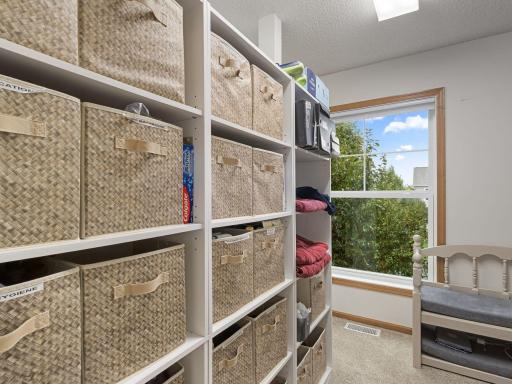 Primary Closet Organized Dressing & Storage Area
