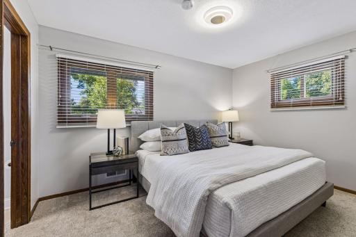 ensuite bedroom comfortably fits a king size bed and dresser. Room also has (2) closets and a clean half bath.