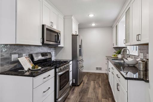 Beautiful updated kitchen with granite, gas stove and dishwasher.
