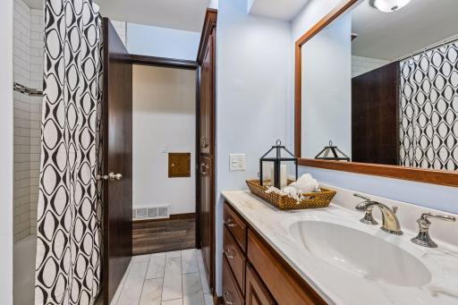main bath has generous vanity and linen storage