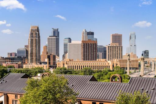 Impressive views of the Downtown Minneapolis skyline and surrounding riverfront architecture from unit F704