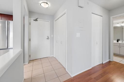 Welcoming entryway with tile flooring, multiple closets, and convenient access to the kitchen and bathroom.