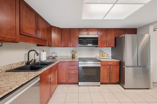 Kitchen with stainless steel appliances, a sleek induction range, and plenty of room for meal preparation.