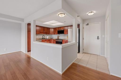 Open-concept layout connects the kitchen, dining area, and living space while maintaining a welcoming entryway.