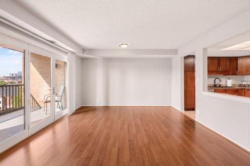 Bright and open living area offers flexible space for both relaxing and entertaining.