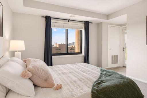 Wake up to exciting city views and abundant natural light from the bedroomâs large window.