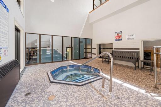 Indoor hot tub area located near the pool and sauna.