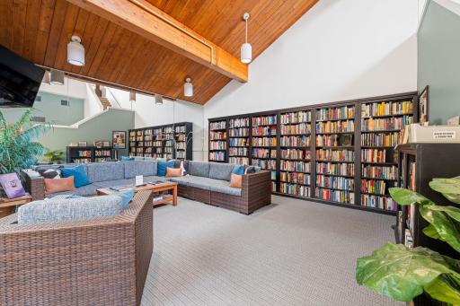 Building library and lounge with vaulted wood ceiling and comfortable seating.