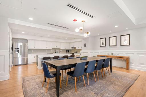 Large community dining area with full kitchen, perfect for entertaining or hosting gatherings.