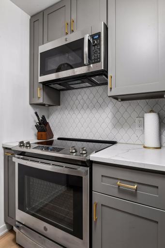 New GE stainless steel range and microwave complete the beautifully updated kitchen.
