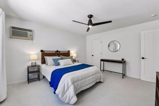 The primary bedroom also features a spacious walk-in closet with plenty of storage.