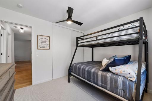 The guest bedroom also features a large closet with plenty of storage space.