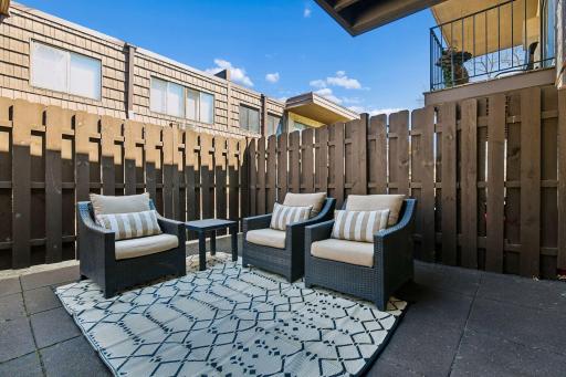 The large private outdoor patio feels like an extension of the family room, creating additional space to relax, entertain, and enjoy the outdoors.