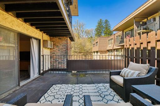 The large private outdoor patio feels like an extension of the family room, creating additional space to relax, entertain, and enjoy the outdoors.