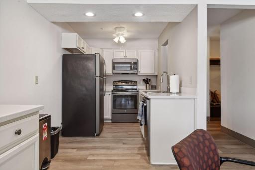 The community party room includes a convenient kitchen, perfect for hosting gatherings and entertaining guests.
