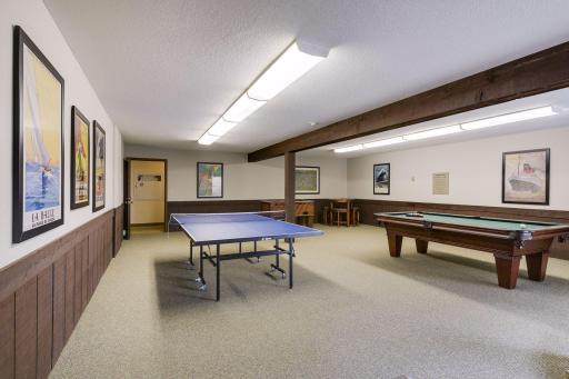 Community game room provides another great space to relax, gather, and enjoy time with friends and neighbors.