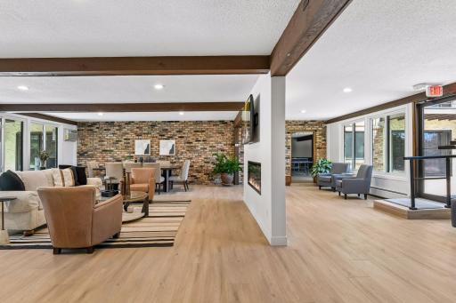 Inviting community lounge with a cozy fireplace offers the perfect place to relax and gather.
