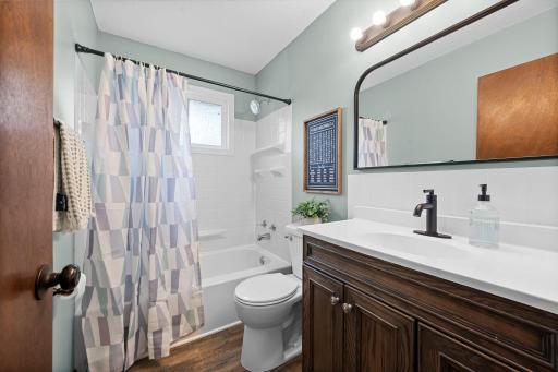 Updated main-floor full bath with tub/shower & modern black fixtures