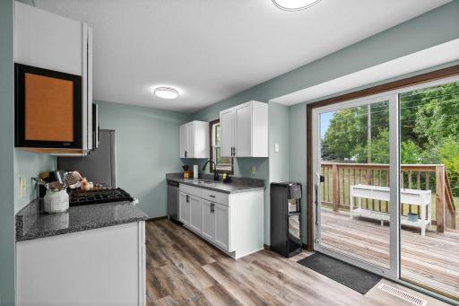 Updated kitchen with granite countertops & white shaker cabinets
