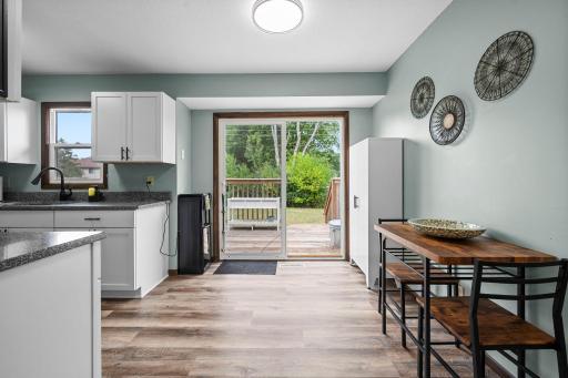 Eat-in dining space with sliding glass door to the backyard deck