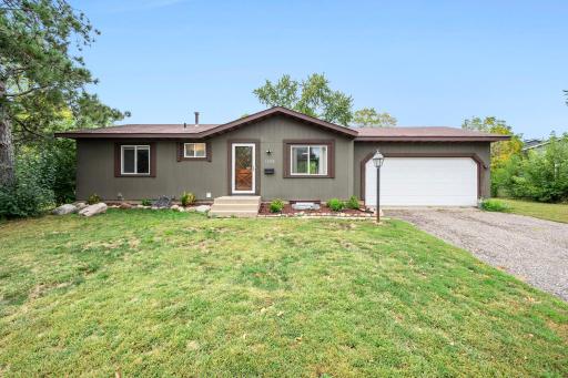 Sunny front yard, mature trees & welcoming front entry