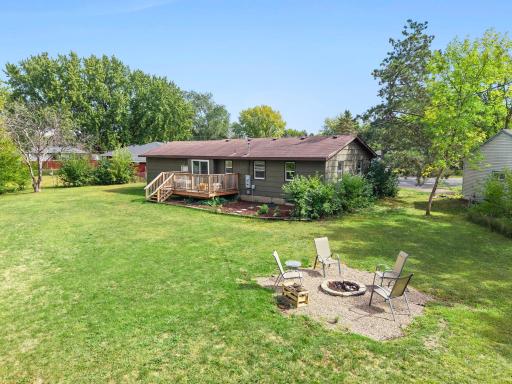Fire pit, deck & sprawling lawn all in one view