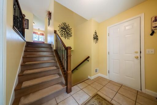 Foyer, stairs to both levels, door to garage