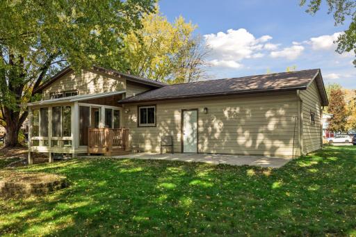 Step outside to the generous 29 x 11-foot concrete patio, offering plenty of room for outdoor dining, entertaining, or relaxing among the mature trees.